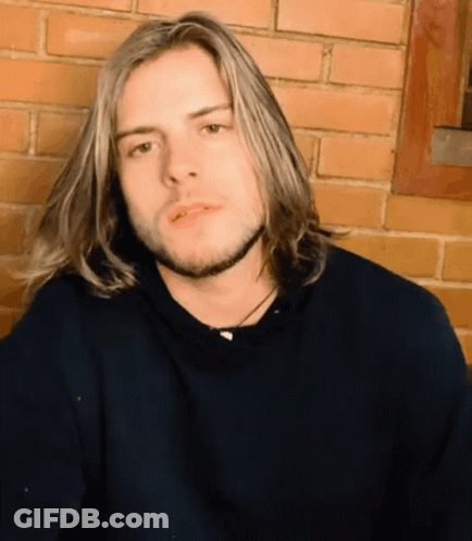 Young Man With Long Blonde Hair And Beard GIF