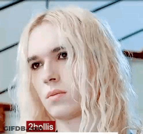 Young Man With Long Blonde Hair Serious Look GIF