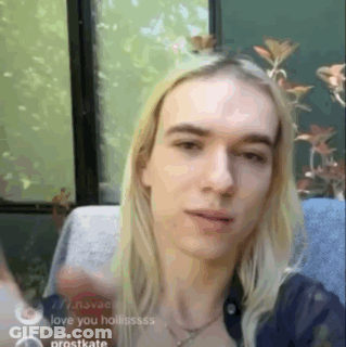 Young Man With Long Blonde Hair Waving GIF