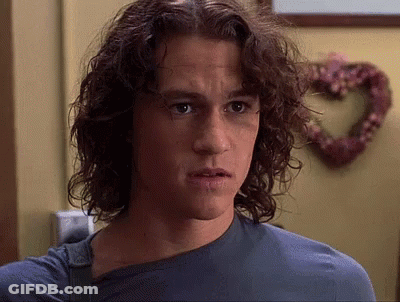 Young Man With Long Curly Hair And Blue Shirt GIF