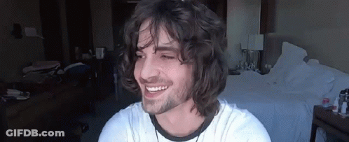 Young Man With Long Curly Hair Smiling GIF