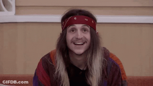 Young Man With Long Hair And Red Bandana Smiling GIF