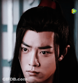 Young Man With Long Hair Close Up GIF
