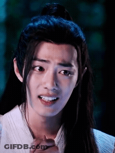 Young Man With Long Hair Making Funny Face GIF