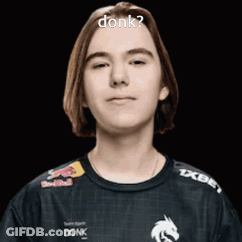 Young Man With Long Hair Wearing Black Shirt With Red Bull Logo GIF