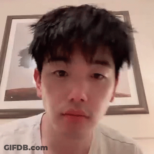 Young Man With Messy Haircut Making Funny Face GIF