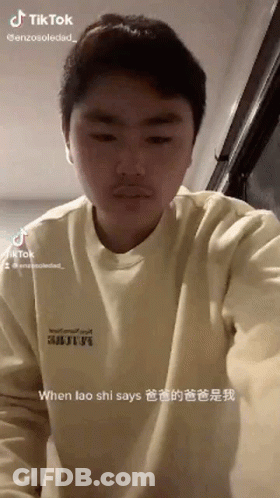 Young Man With Mustache In Yellow Sweater Making Funny Face GIF