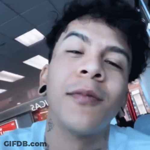 Young Man With Neck Tattoo Close Up GIF
