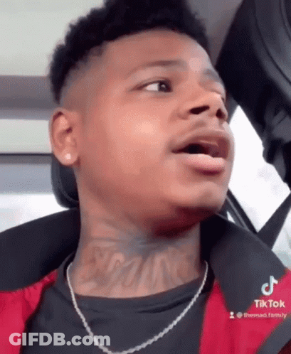 Young Man With Neck Tattoo Sitting In Car GIF