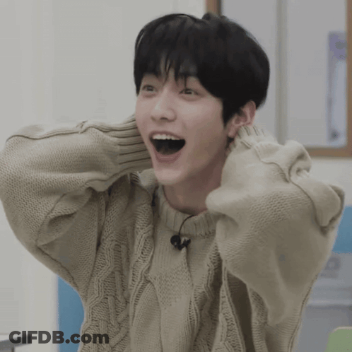 Young Man With Open Mouth In Tan Sweater GIF