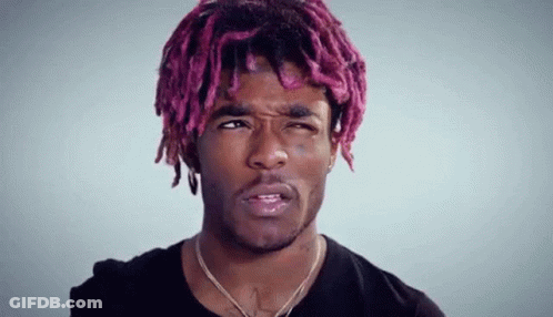 Young Man With Pink Hair And Dreadlocks Making Face GIF