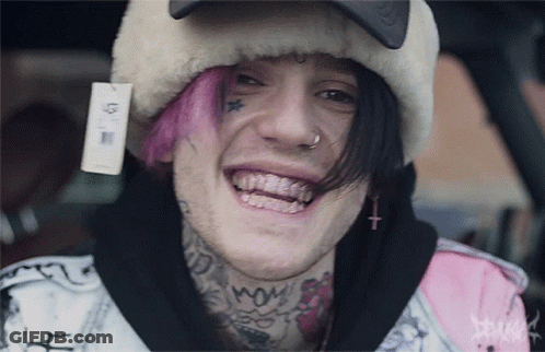 Young Man With Pink Hair And Face Tattoo Smiling GIF