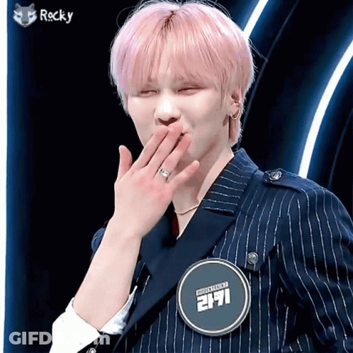 Young Man With Pink Hair And Rocky Badge GIF