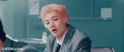 Young Man With Pink Hair In Suit And Tie GIF