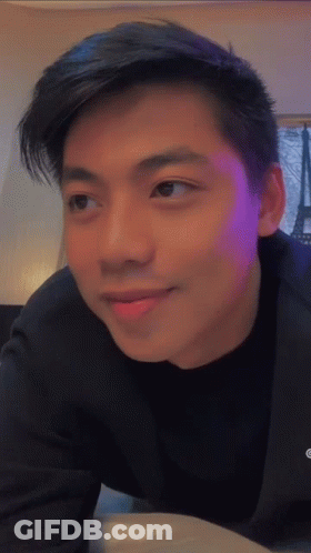 Young Man With Purple Backlight GIF
