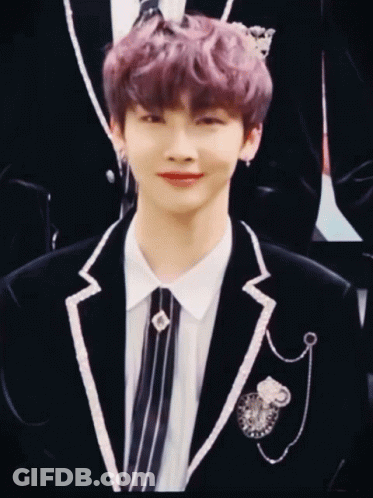 Young Man With Purple Hair In Black Jacket And Tie GIF