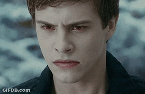 Young Man With Red Eyes Looking At Camera GIF