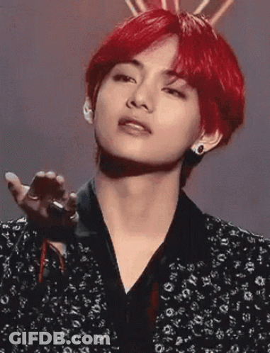 Young Man With Red Hair And Black Jacket Holding Microphone GIF