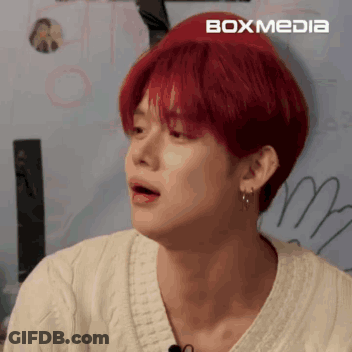 Young Man With Red Hair And Earrings GIF