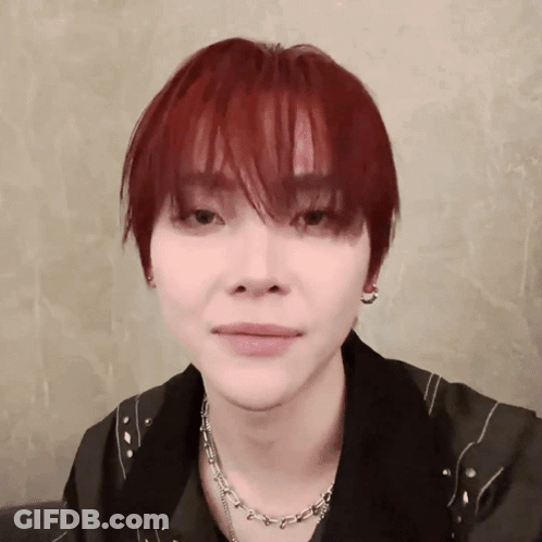 Young Man With Red Hair And Necklace GIF