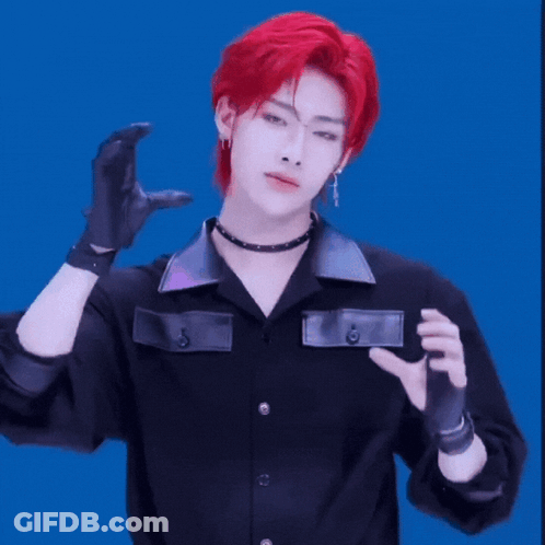 Young Man With Red Hair In Black Shirt And Gloves GIF