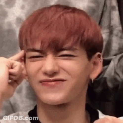 Young Man With Red Hair Making Funny Face And Holding Ear GIF