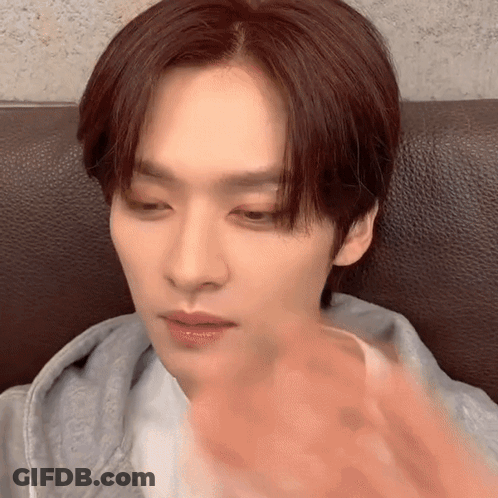 Young Man With Red Hair Making Funny Face On Couch GIF