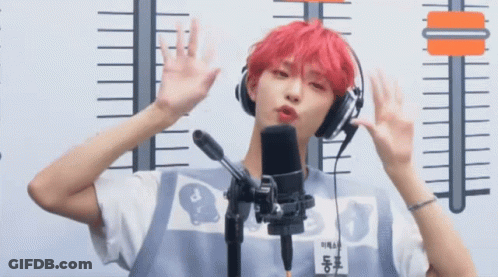 Young Man With Red Hair Wearing Headphones And Name Tag A GIF