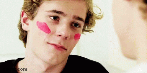 Young Man With Red Lipstick Looking At Another Man GIF