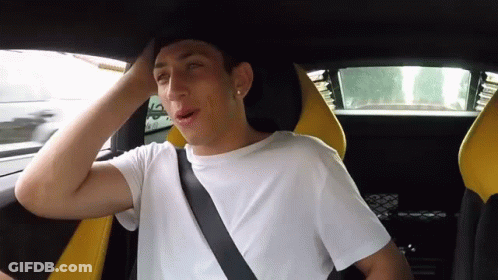 Young Man With Seat Belt Around Neck In Car GIF