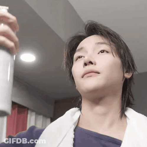 Young Man With Spray Bottle GIF
