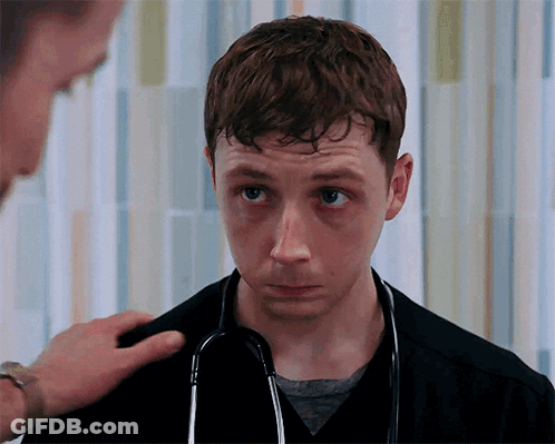 Young Man With Stethoscope Looks At Camera GIF
