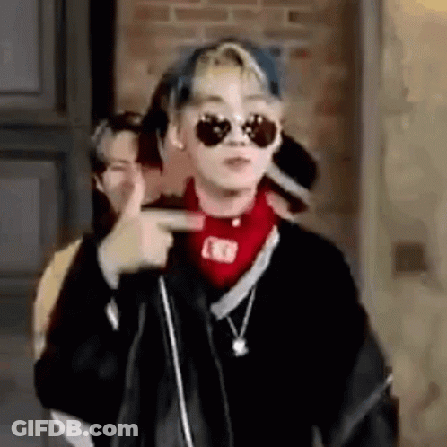 Young Man With Sunglasses And Red Bandana Pointing GIF