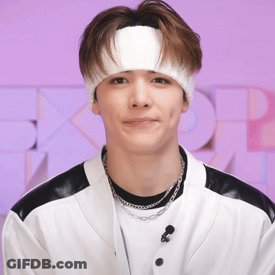 Young Man With White Headband And Necklace GIF