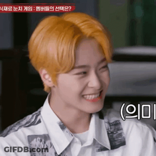 Young Man With Yellow Hair Smiling In White Shirt GIF