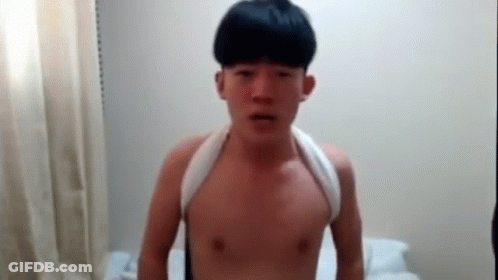 Young Man Without Shirt With Towel Around Neck GIF