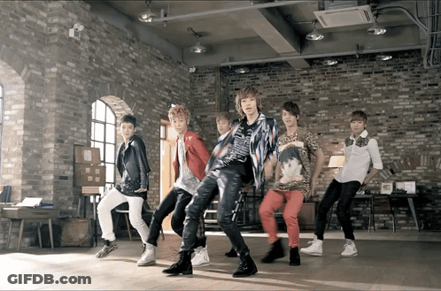 Young Men Dancing In Brick Wall Room GIF