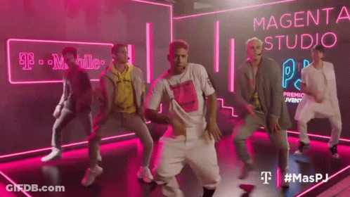 Young Men Dancing In Front Of Magenta Sign GIF