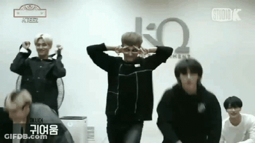 Young Men Dancing In Front Of Studio Sign GIF