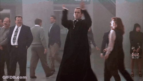 Young Men Dancing One Wearing Letter E GIF