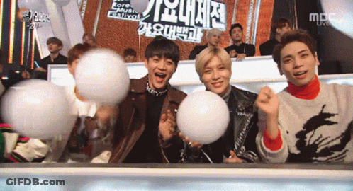 Young Men Holding Cotton Candy Balls At Korea Music Festival GIF