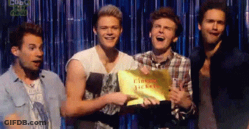 Young Men Holding Sign Saying Tickets GIF