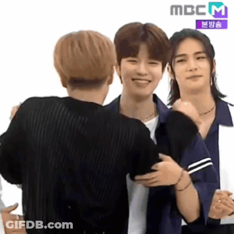 Young Men Hugging And Smiling GIF