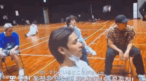 Young Men In Face Masks On Basketball Court GIF