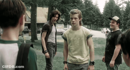Young Men In Grassy Area One Wearing Yellow Vroom Shirt GIF