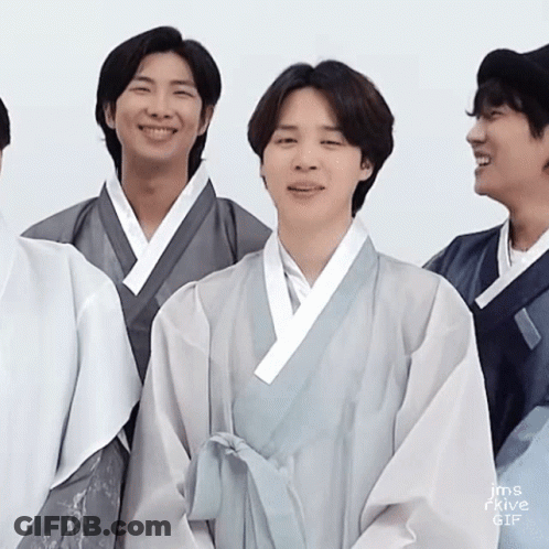 Young Men In Kimonos Smiling For Camera GIF