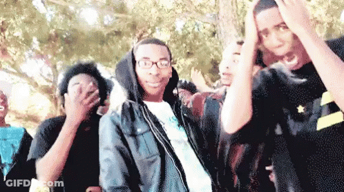 Young Men In Line One With Glasses And Hoodie GIF