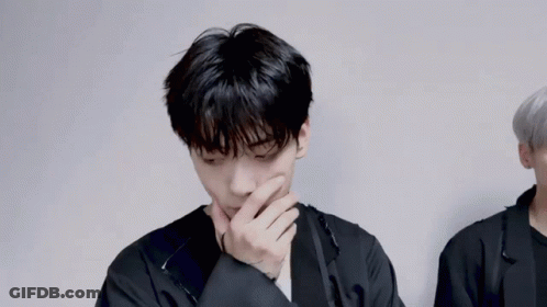 Young Men In Military Uniforms Standing Together GIF