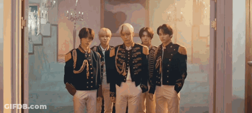 Young Men In Military Uniforms Standing Together GIF
