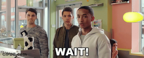 Young Men In Store Saying Wait GIF